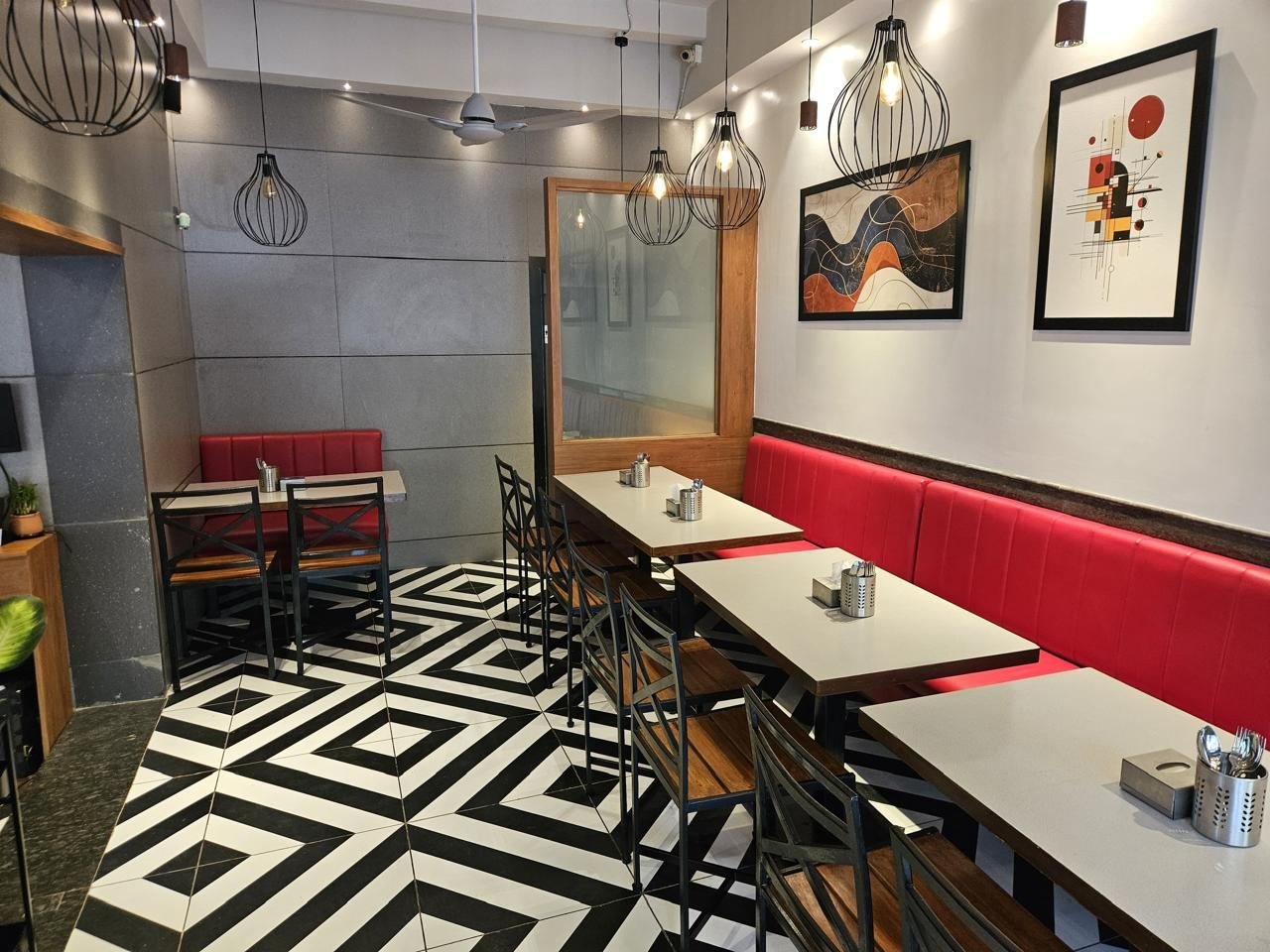 Dining area with geometric floor tiles